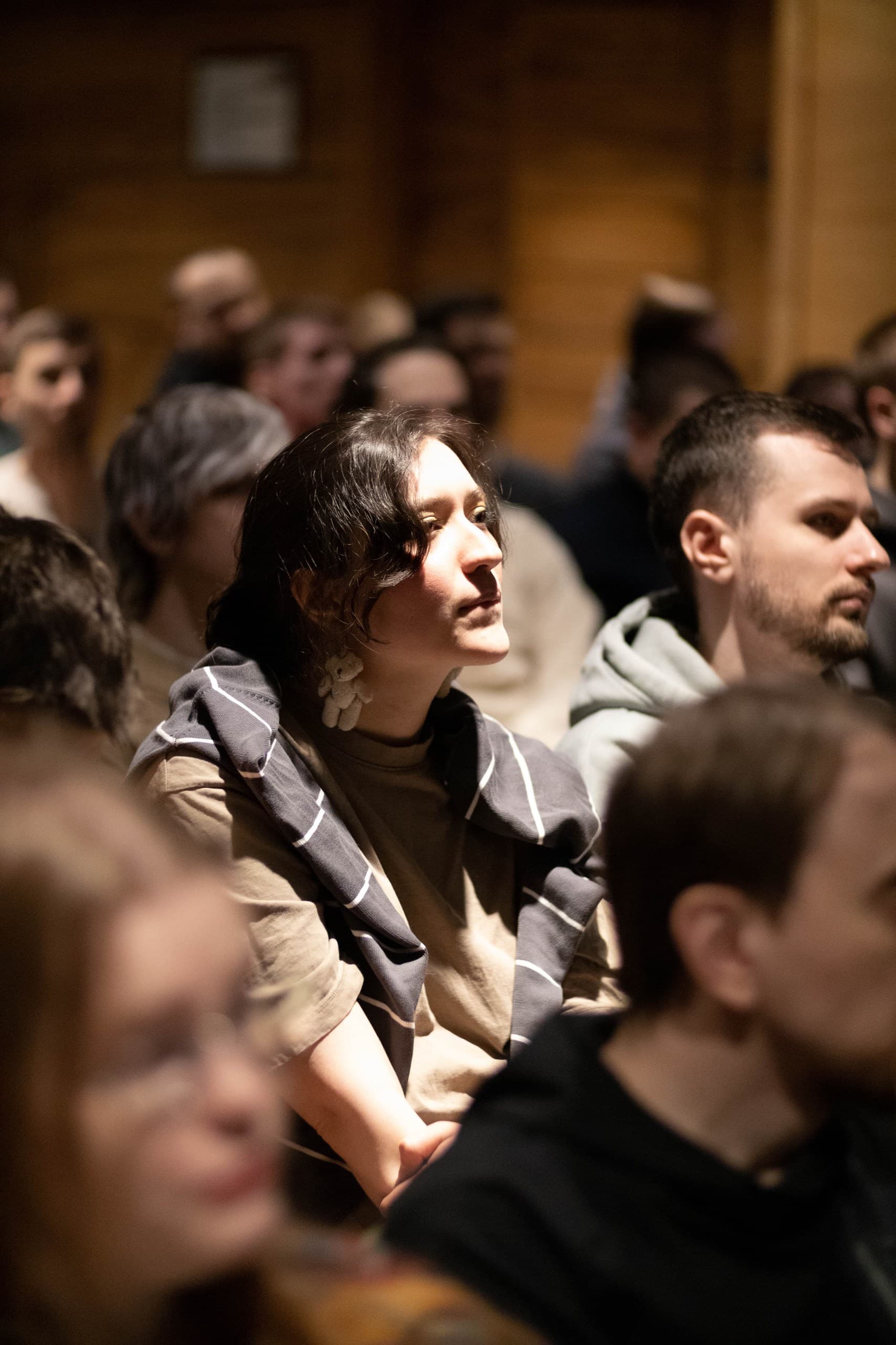 Audience members listening attentively